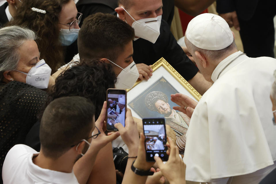 Pope Francis greets the faithful at the end of his weekly general audience in the Paul VI hall at the Vatican, Wednesday, Aug. 11, 2021. (AP Photo/Riccardo De Luca)