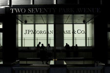 People walk inside JP Morgan headquarters in New York, October 25, 2013. REUTERS/Eduardo Munoz