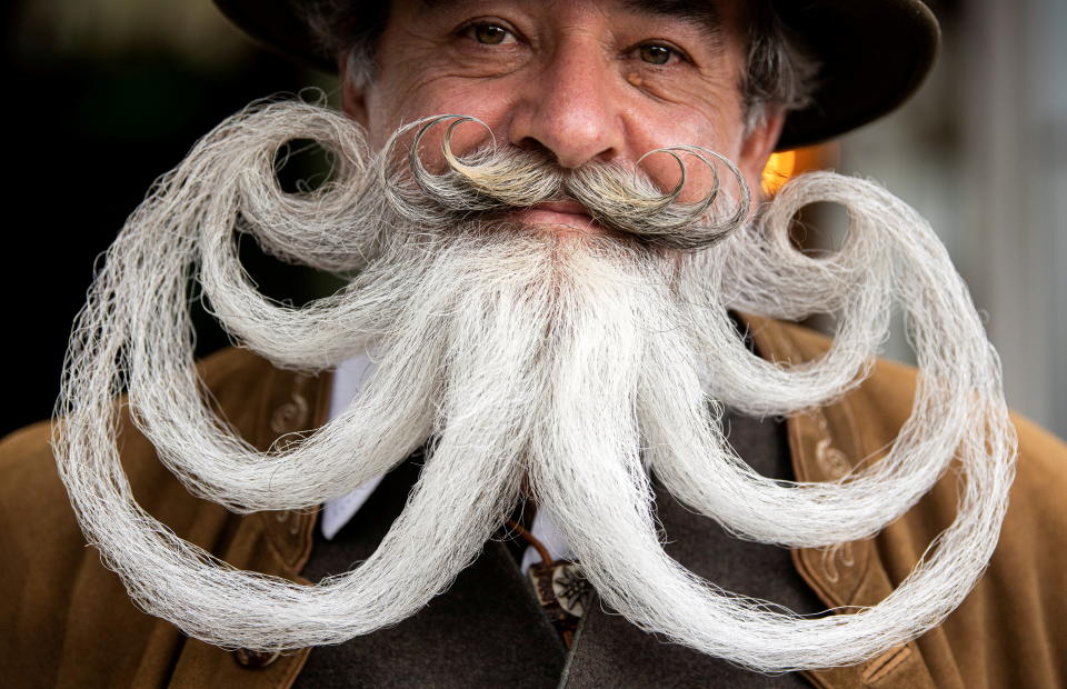 Participant Norbert Dopf from Austria arrives for the German Moustache and Beard Championships 2021 at Pullman City Western Theme Park in Eging am See, Germany, October 23, 2021. REUTERS/Lukas Barth     TPX IMAGES OF THE DAY