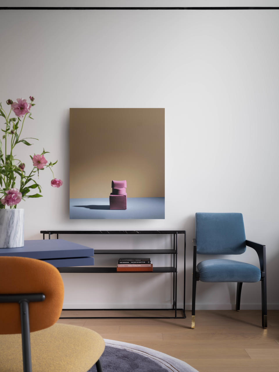 A living room with light blue chairs and a yellow chair