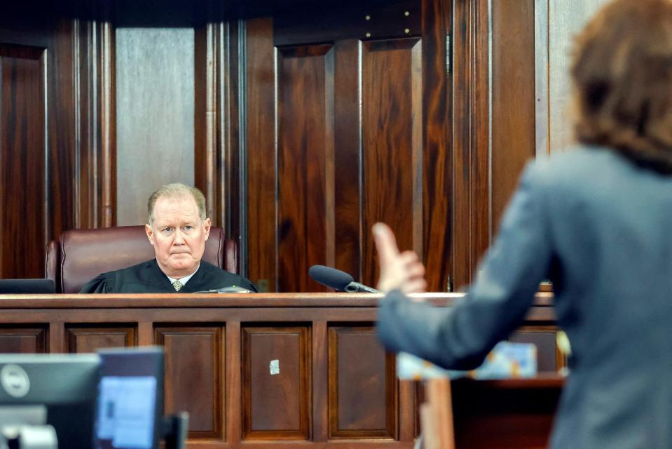 Superior Court Judge Timothy Walmsley, left, listens to prosecutor Linda Dunikoski's opening statement during the sentencing of Greg McMichael and his son, Travis McMichael, and a neighbor, William 