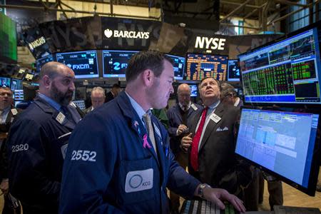 Traders work on the floor of the New York Stock Exchange February 18, 2014. REUTERS/Brendan McDermid