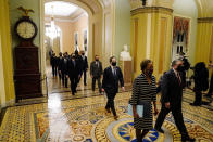 Clerk of the House Cheryl Johnson along with acting House Sergeant-at-Arms Tim Blodgett lead the Democratic House impeachment managers as they walk through the Capitol Hill to deliver to the Senate the article of impeachment alleging incitement of insurrection against former President Donald Trump, in Washington, Monday, Jan. 25, 2021. (Melina Mara/The Washington Post via AP, Pool)