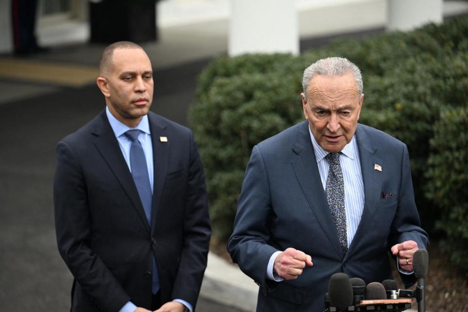 PHOTO: Senate Majority Leader Chuck Schumer speaks to reporters as House Minority Leader Hakeem Jeffries looks on after a meeting with US President Joe Biden and Congressional leadership at the White House in Washington, DC, on January 27, 2024. (Jim Watson/AFP via Getty Images)