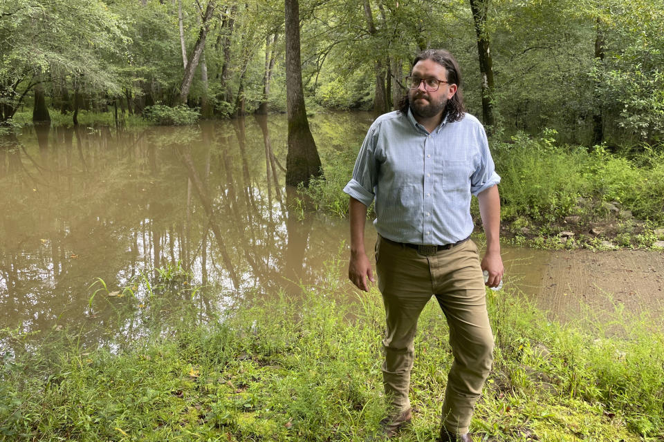 Seth Clark, mayor pro-tem of Macon, walks in the Bond Swamp National Wildlife Refuge in Round Oak, Ga., on Aug. 22, 2022. (AP Photo/Michael Warren)