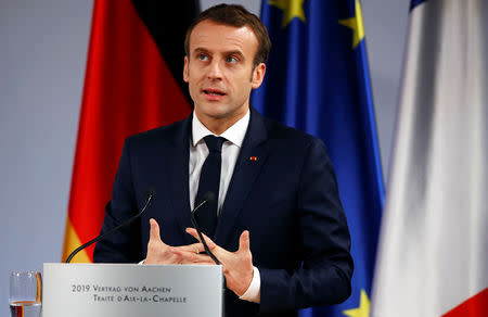 French President Emmanuel Macron speaks during a signing of a new agreement on bilateral cooperation and integration, known as Treaty of Aachen, in Aachen, Germany, January 22, 2019. REUTERS/Wolfgang Rattay