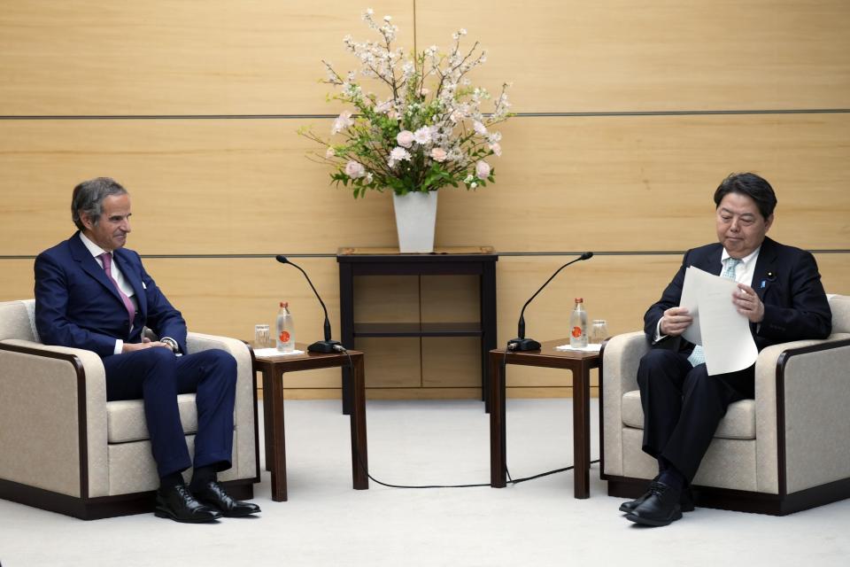 International Atomic Energy Agency Director General Rafael Mariano Grossi, left, and Japan's Chief Cabinet Secretary Yoshimasa Hayashi, right, attend their meeting at the prime minister's office Tuesday, March 12, 2024, in Tokyo. (AP Photo/Eugene Hoshiko, Pool)