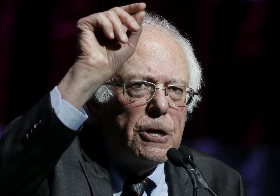 Sen. Bernie Sanders, I-Vt., addresses an audience during a rally Friday, March 31, 2017, in Boston. Sanders and Sen. Elizabeth Warren, D-Mass., made a joint appearance at the evening rally in Boston as liberals continue to mobilize against the agenda of Republican President Donald Trump. (AP Photo/Steven Senne)