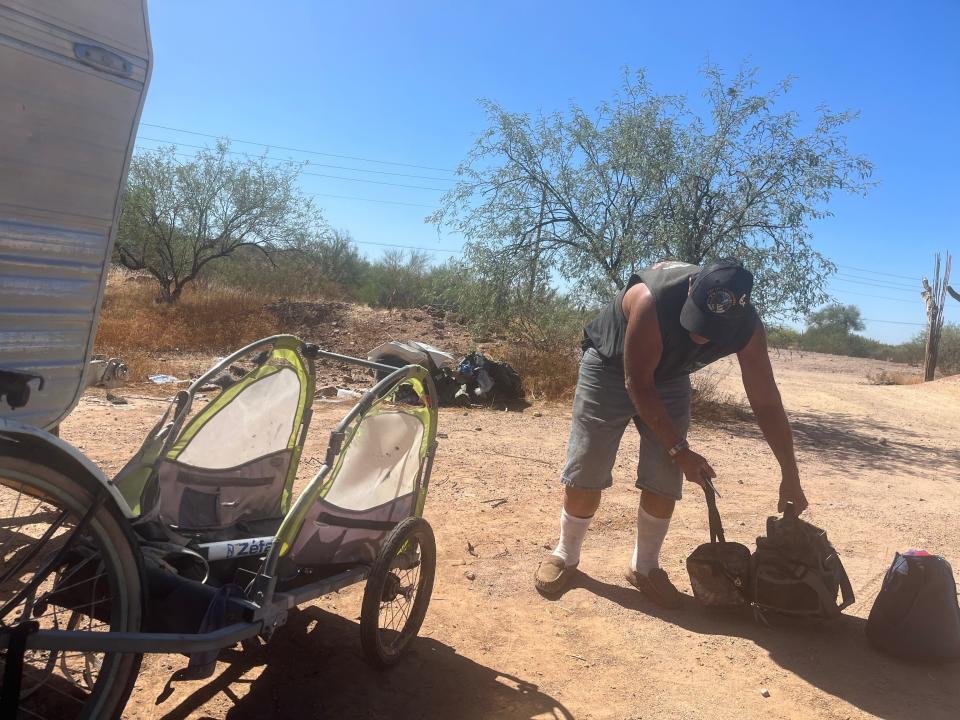 Steven Lee Thomas packs up to find another place to camp on Oct. 3, 2023.