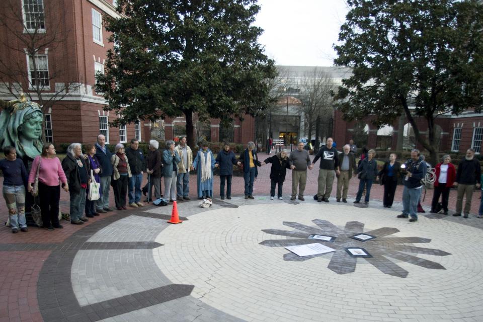 Supporters of Sister Megan Rice, Michael Walli, and Greg Boertje-Obed gather outside after the three were sentenced for their roles in a July 2012 break-in at the Y-12 National Security Complex in Knoxville, Tenn., Tuesday, Feb. 18, 2014. Sister Megan Rice, 84, was sentenced to nearly three years in prison and Michael Walli and Greg Boertje-Obed were sentenced to more than five years in prison. The break-in raised questions about the safekeeping at the facility that holds the nation's primary supply of bomb-grade uranium. (AP Photo/The Knoxville News Sentinel, Saul Young)