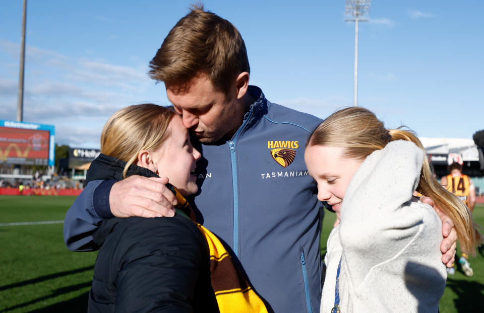 LAUNCESTON, AUSTRALIA - AUGUST 13: Sam Mitchell, Senior Coach of the Hawks is seen with daughters Emmerson and Scarlett during the 2023 AFL Round 22 match between the Hawthorn Hawks and the Western Bulldogs at University of Tasmania Stadium on August 13, 2023 in Launceston, Australia. (Photo by Michael Willson/AFL Photos via Getty Images)