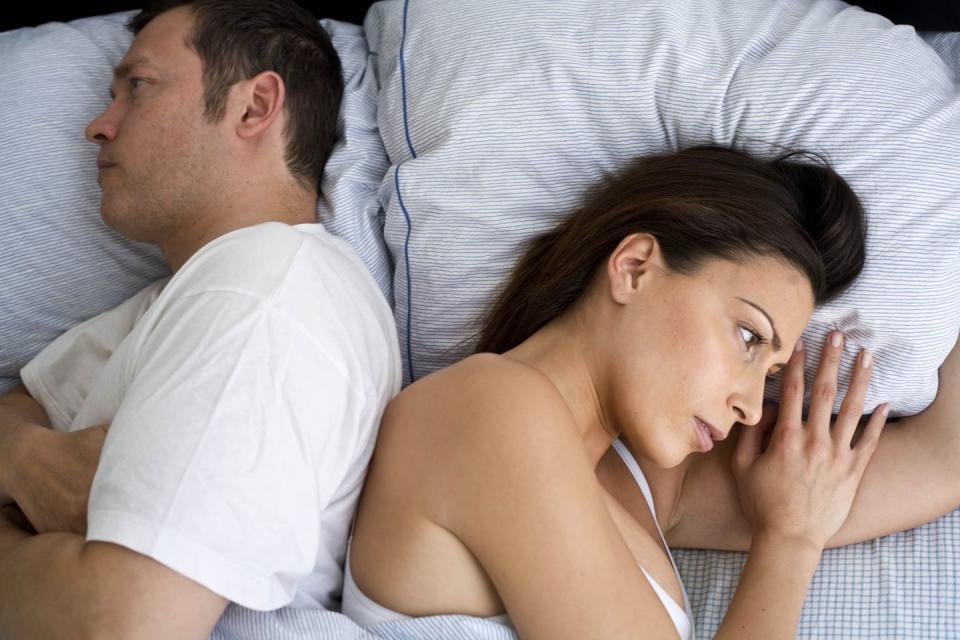 what to do after a fight husband and wife facing away from each other in bed