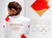 Tokyo 2020 Torch Relay Official Ambassador and actress Satomi Ishihara presents the Olympic torchbearers' uniform in Tokyo