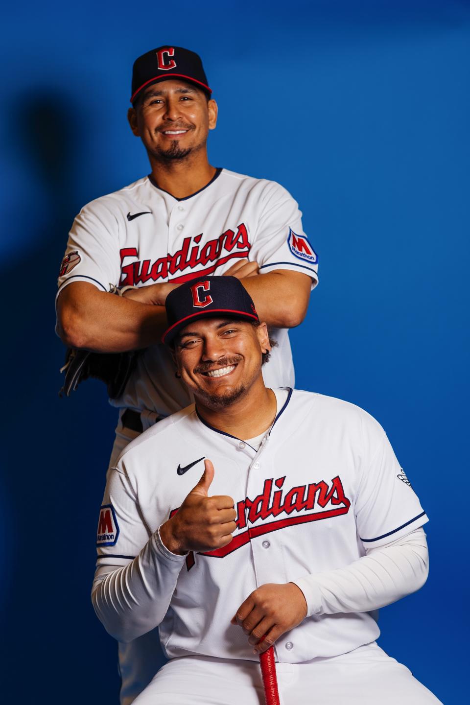 GOODYEAR, ARIZONA - FEBRUARY 22: Josh Naylor #22 and Carlos Carrasco of the Cleveland Guardians pose for a portrait at Goodyear Ballpark on February 22, 2024 in Goodyear, Arizona. (Photo by Carmen Mandato/Getty Images)