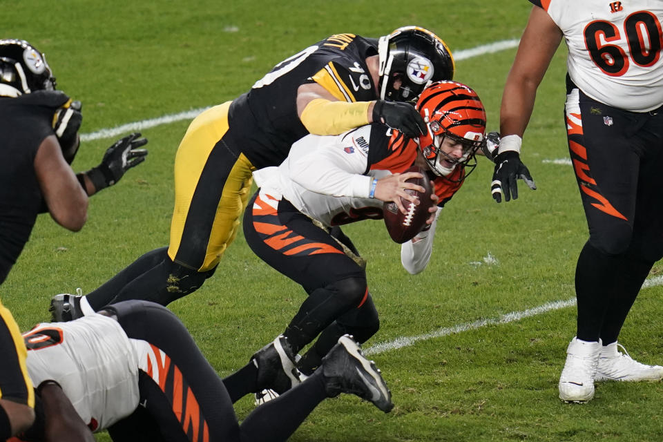 Cincinnati Bengals quarterback Joe Burrow (9) is sacked by Pittsburgh Steelers outside linebacker T.J. Watt (90) during the first half of an NFL football game, Sunday, Nov. 15, 2020, in Pittsburgh. (AP Photo/Keith Srakocic)