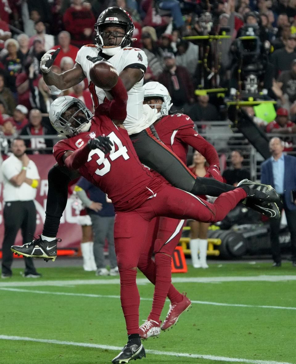 Arizona Cardinals safety Jalen Thompson (34) breaks up a pass intended for Tampa Bay Buccaneers wide receiver Chris Godwin during the second half of an NFL football game, Sunday, Dec. 25, 2022, in Glendale, Ariz. (AP Photo/Rick Scuteri)