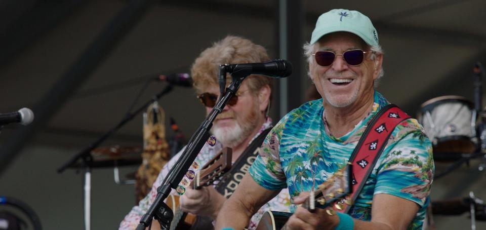 Jimmy Buffett (right) is one of the 50-plus performers featured in "Jazz Fest: A New Orleans Story," a documentary chronicling five decades of the legendary New Orleans Jazz & Heritage Festival.