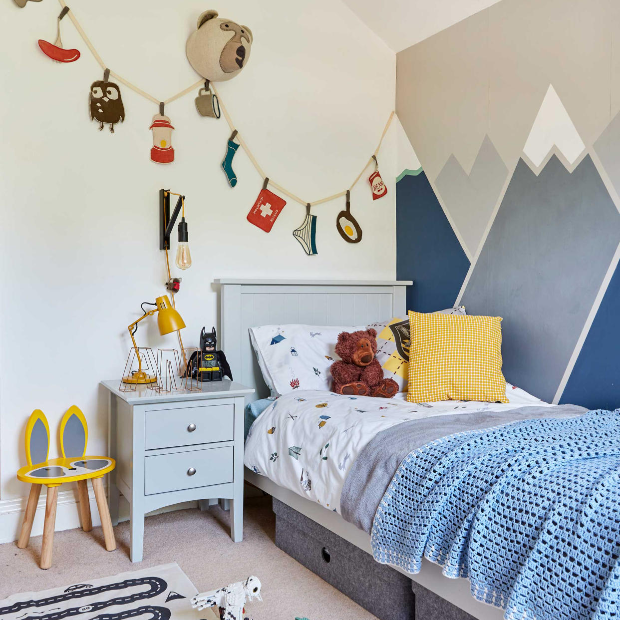  Blue kids room with mountain paint effect. 