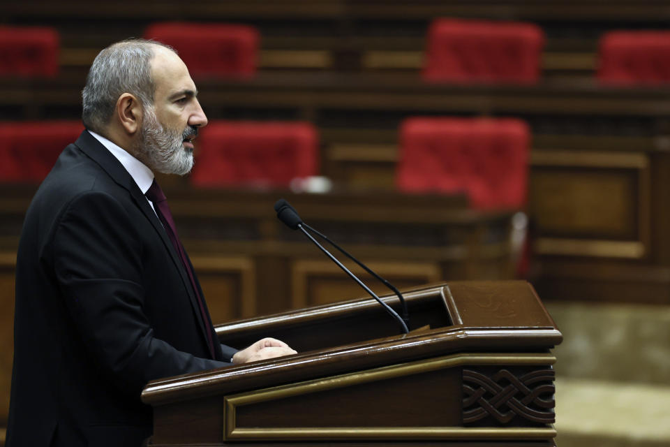 Armenian Prime minister Nikol Pashinyan delivers his speech at the National Assembly of Armenia in Yerevan, Armenia, Tuesday, Sept. 13, 2022. Armenia's prime minister says that 49 soldiers have been killed in nighttime attacks by Azerbaijan. (Tigran Mehrabyan/PAN Photo via AP)