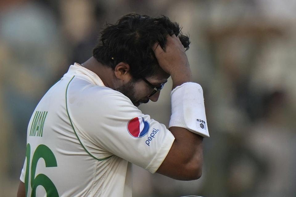 Pakistan's Imam-ul-Haq reacts as he walks off the field after his dismissal during the third day of the second test cricket match between Pakistan and England, in Multan, Pakistan, Sunday, Dec. 11, 2022. (AP Photo/Anjum Naveed)