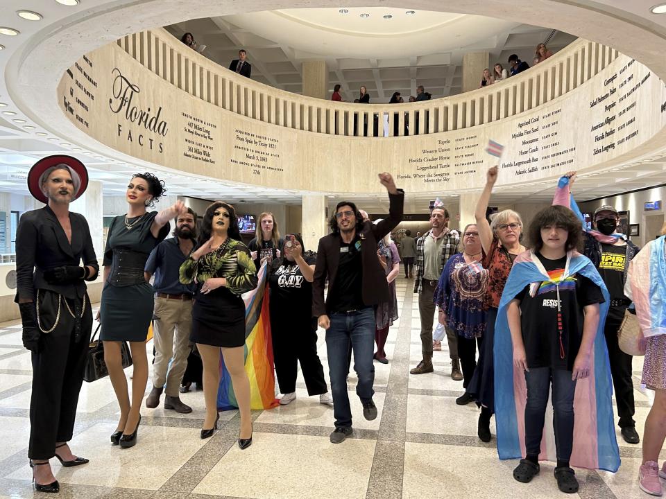 Demonstrators protest outside the Florida House chambers against bills the chamber passed on gender-transition treatments, bathroom use and keeping children out of drag shows, Wednesday April 19, 2023 in Tallahassee, Fla. (AP Photo/Brendan Farrington)