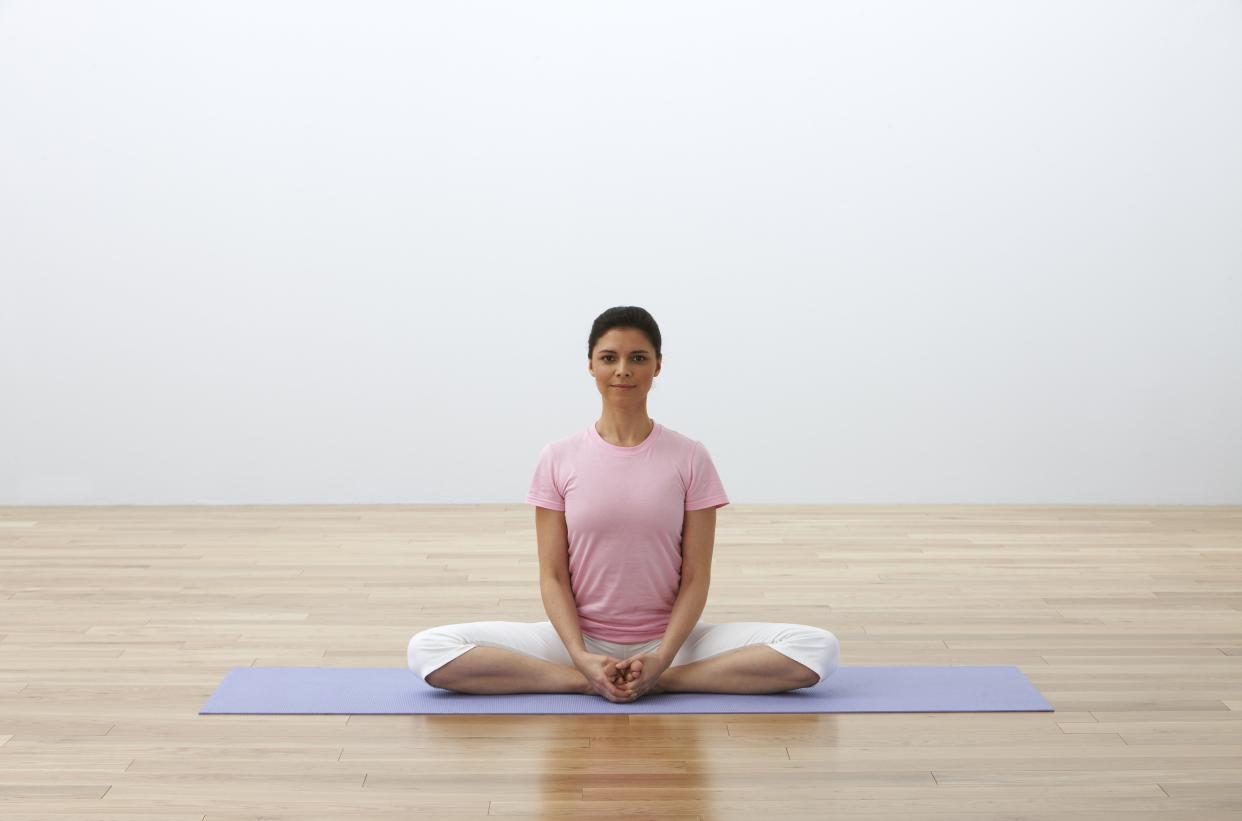 This pose helps to open the hips and ease sciatica discomfort that can be made worse by sitting for long periods.  Sit up tall with the soles of the feet touching and knees spreading open, bringing the feet in toward the pelvis and clasping your hands around your feet. Flap the knees up and down several times like butterfly wings, then sit still and focus the weight of the hips and thighs into the floor, easing pain in the sciatic nerve.  "The sciatic nerve starts in the lower back and runs down both leg, and sciatic nerve pain can occur when the nerve is somehow compressed," Bielkus says. "Long commutes and sitting for long periods of time exacerbates it."