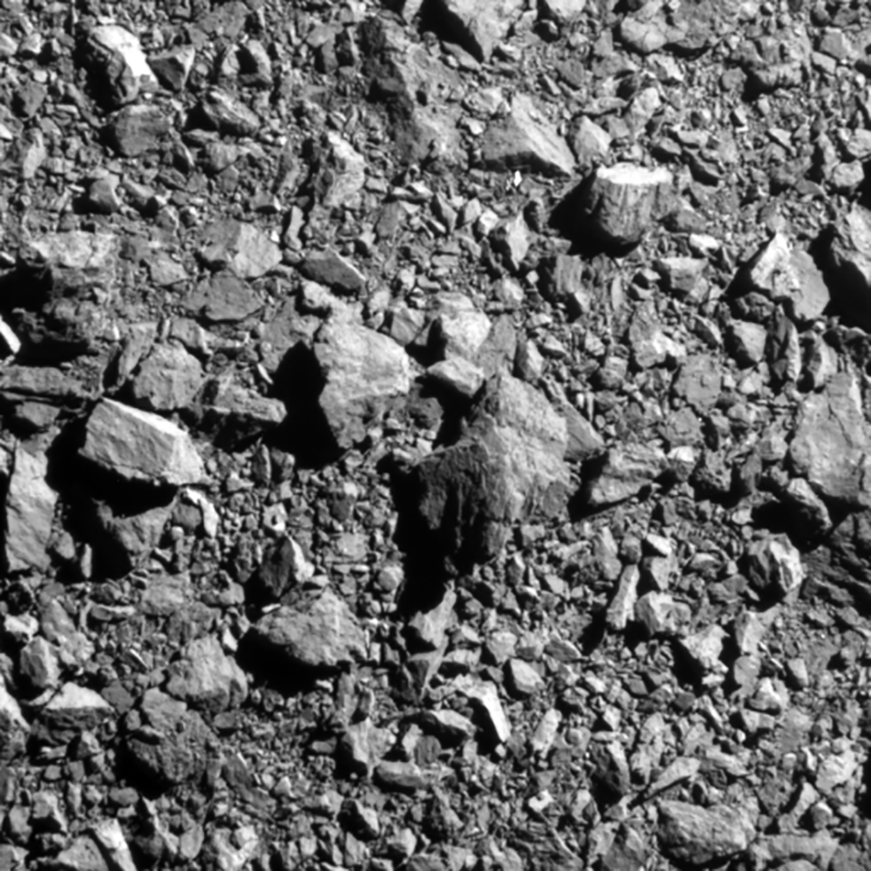 a dense pile of rocks seen in black and white