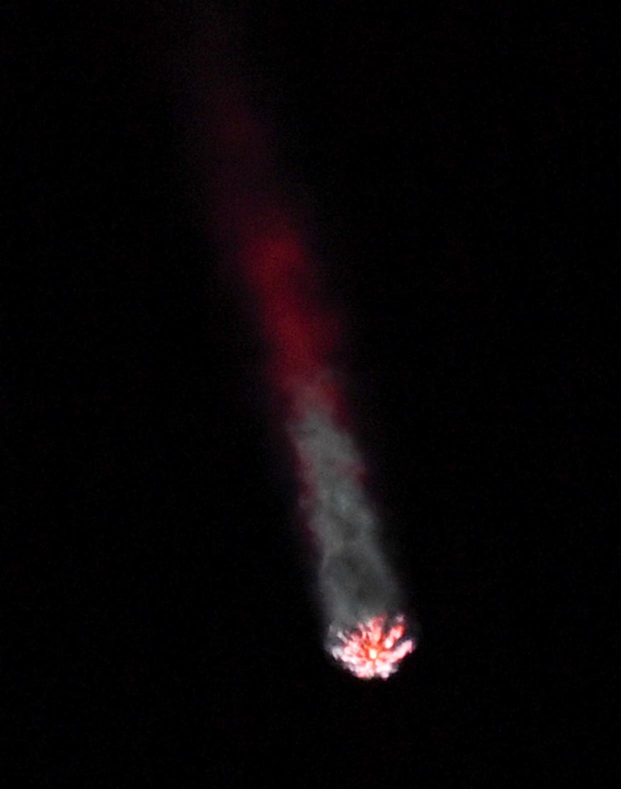 A SpaceX Falcon 9 rocket streaks across the nighttime sky Tuesday after liftoff from Cape Canaveral Space Force Station.