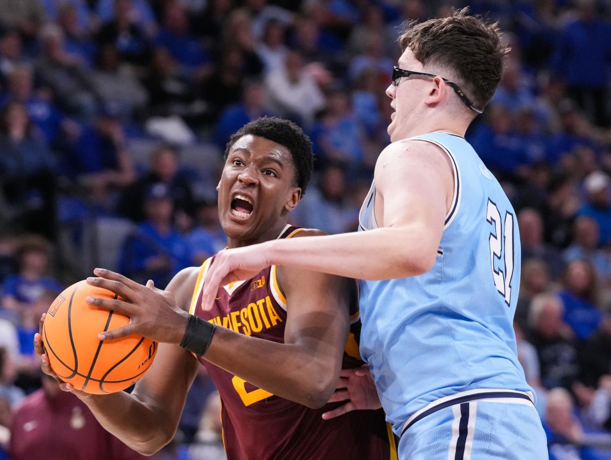 Minnesota Golden Gophers forward Pharrel Payne (21) rushes up the court against Indiana State Sycamores center Robbie Avila (21) on Sunday, March 24, 2024, during the second round of the NIT at the Hulman Center in Terre Haute. The Indiana State Sycamores defeated the Minnesota Golden Gophers, 76-64.