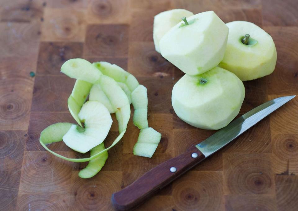 PHOTO: Peeled apples are shown on a cutting board. (Laurence Mouton/PhotoAlto via Getty Images, FILE)