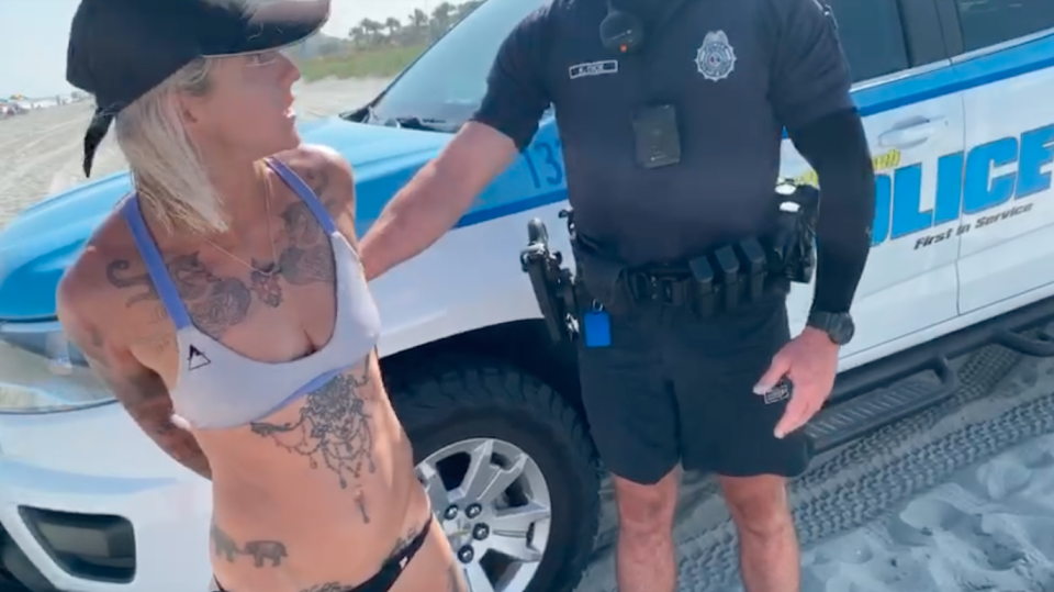 Sam Panda handcuffed in purple bikini and black G-String bottoms in South Carolina Myrtle Beach