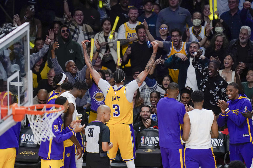 Los Angeles Lakers' Anthony Davis (3) fires up the fans during the second half in Game 6 of the team's first-round NBA basketball playoff series against the Memphis Grizzlies on Friday, April 28, 2023, in Los Angeles. (AP Photo/Jae C. Hong)