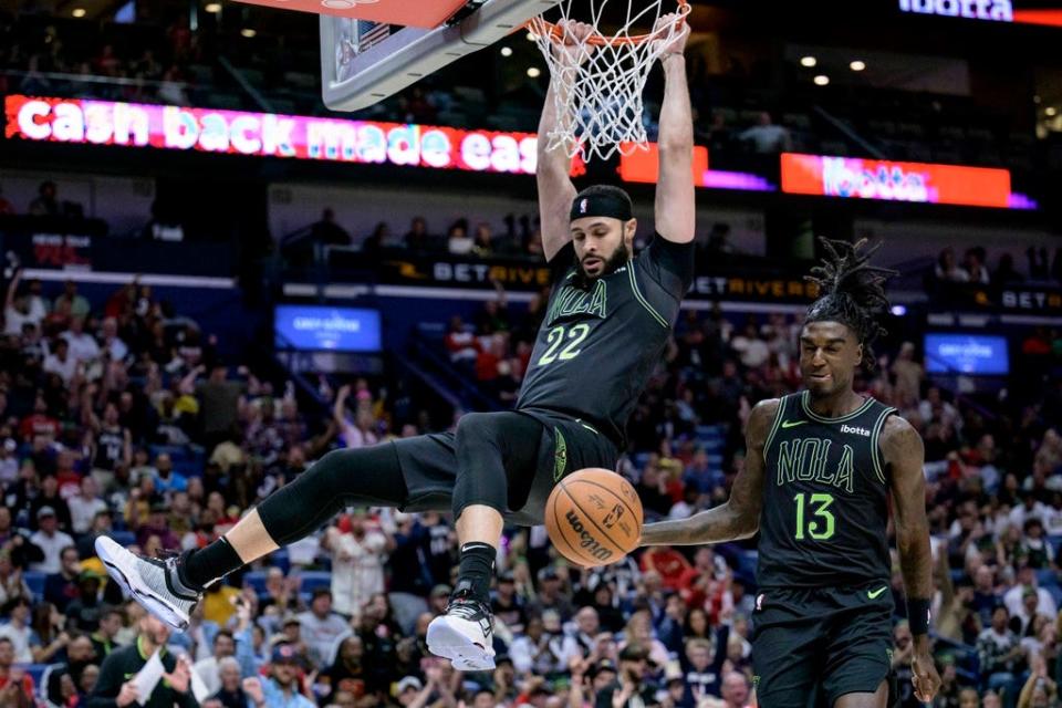 New Orleans Pelicans forward Larry Nance Jr. (22) dunks after a steal by guard Kira Lewis Jr. (13) against the Atlanta Hawks during the first half of an NBA basketball game in New Orleans, Saturday, Nov. 4, 2023. (AP Photo/Matthew Hinton)