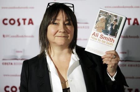 Ali Smith, Nominee in the 2014 Costa Book Awards and winner of the Costa Novel Award category, poses with her book "How to be Both" prior to the announcement of the overall winner, in London, January 27, 2015. REUTERS/Peter Nicholls