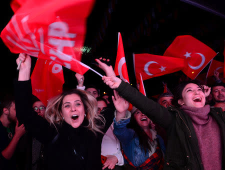 Supporters of the main opposition Republican People's Party (CHP) cheer in front of the party's headquarters as they celebrate the municipal elections results in Ankara, Turkey, March 31, 2019. REUTERS/Stringer