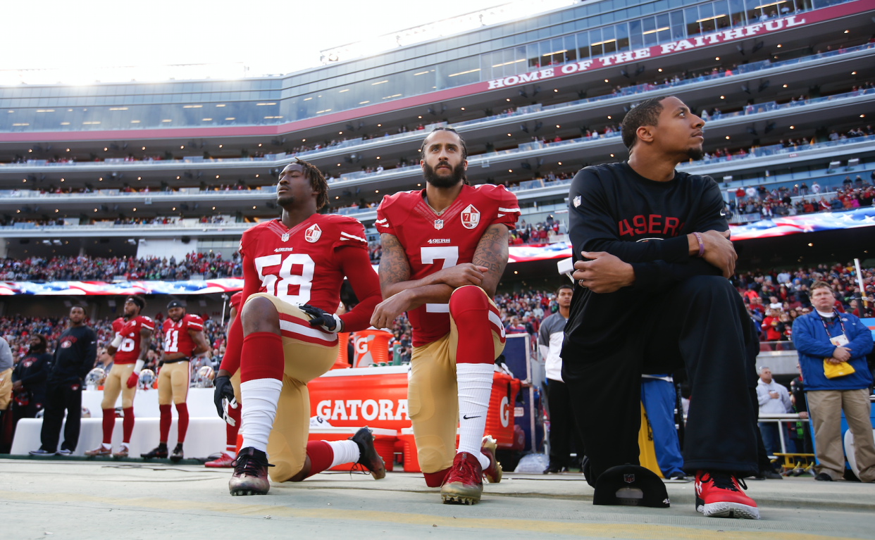 A teacher’s tribute to Colin Kaepernick (pictured in 2017 with Eli Harold and Eric Reid) prompted complaints. (Photo: Michael Zagaris/San Francisco 49ers/Getty Images)