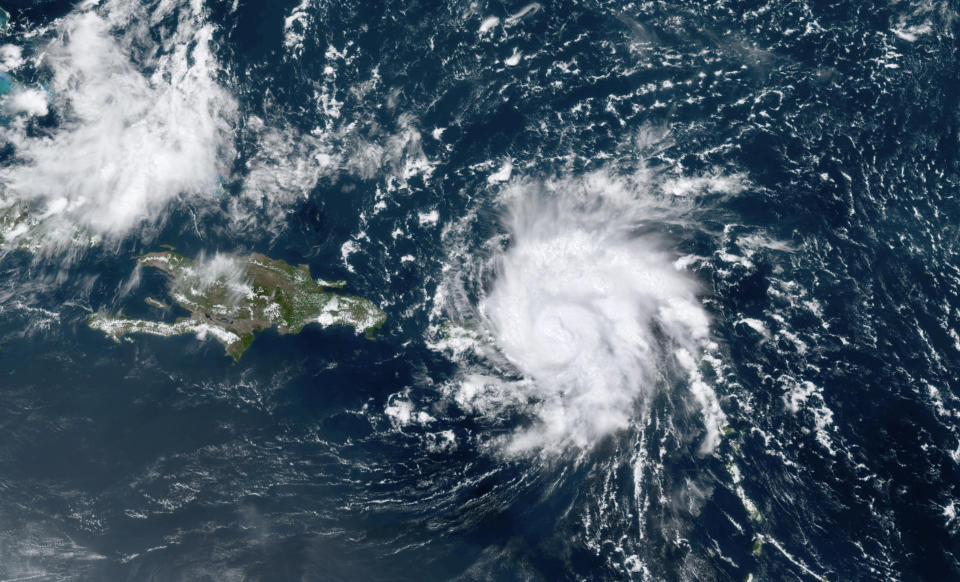 This GOES-16 satellite image taken Wednesday, Aug. 28, 209, at 17:20 UTC and provided by National Oceanic and Atmospheric Administration (NOAA), shows Dorian, a Category 1 hurricane, crossing over the U.S. and British Virgin Islands. Forecasters say it could grow to Category 3 status as it nears the U.S. mainland as early as the weekend. (NOAA via AP)