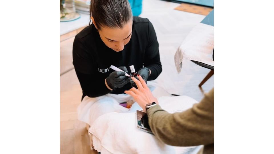 woman having a manicure at home