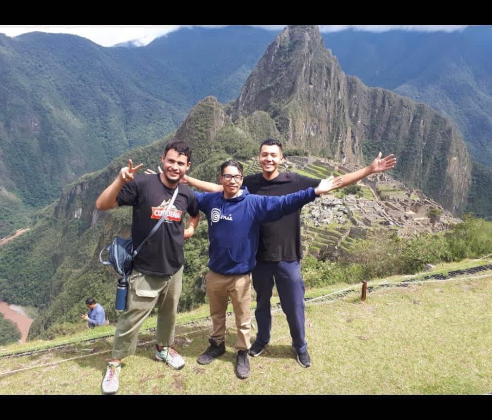 Austin Lathlin-Bercier (centre), pictured at Machu Picchu in Peru, loved travelling the world.