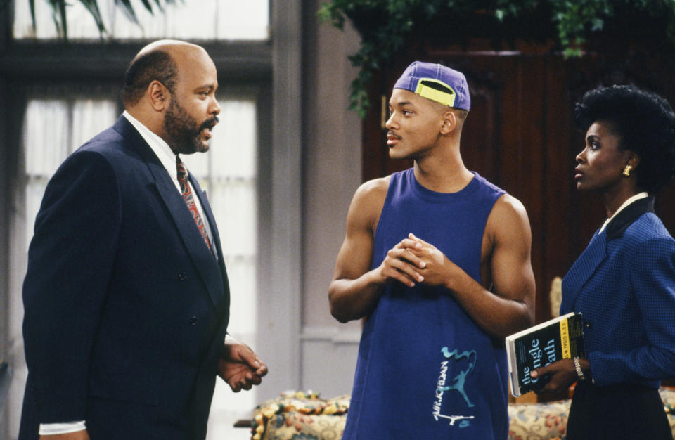 This photo provided by NBC shows, from left, James Avery as Philip Banks, Will Smith as William "Will" Smith, and Janet Hubert as Vivian Banks, in episode 7, "Def Poet's Society" from the TV series, "The Fresh Prince of Bel-Air." Avery, 65, the bulky character actor who laid down the law as the Honorable Philip Banks has died. Avery's publicist, Cynthia Snyder, told The Associated Press that Avery died Tuesday, Dec. 31, 2013. (AP Photo/NBC, Ron Tom)