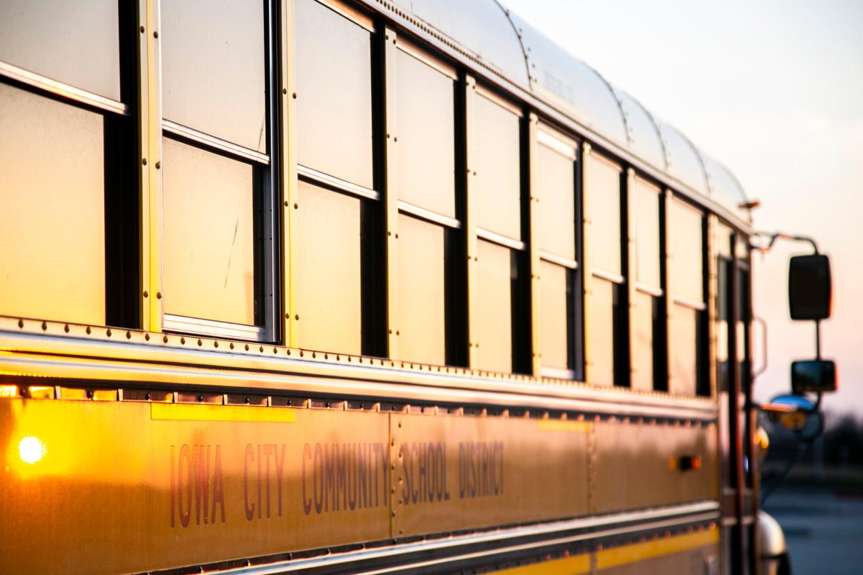 An Iowa City Community School District bus is seen, Monday, April 5, 2021, at Liberty High School in North Liberty, Iowa.