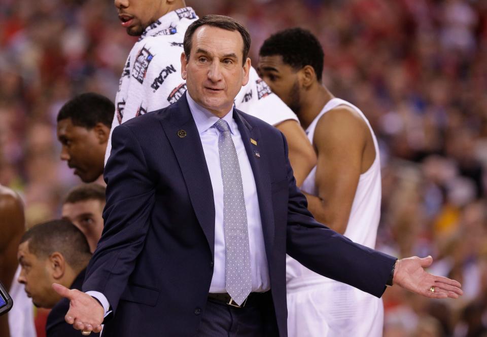 Duke head coach Mike Krzyzewski argues a call during first half of their NCAA Final Four college basketball tournament championship against Wisconsin Monday, April 6 2015 at Lucas Oil Stadium in Indianapolis, Ind.