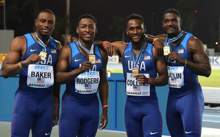 Apr 22, 2017; Nassau, Bahamas; Members of the United States 4 x 100m relay (from mleft): Ronnie Backer and Michael Rodgers and Leshon Collins and Justin Gatlin pose after winning in 38.43 during the IAAF World Relays at Thomas A. Robinson Stadium. Mandatory Credit: Kirby Lee-USA TODAY Sports