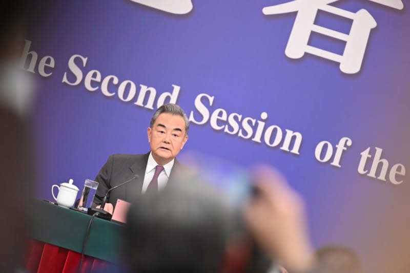 Wang Yi, China's Foreign Minister, speaks during a press conference at the National People's Congress (NPC). Johannes Neudecker/dpa