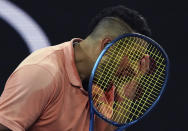 Australia's Nick Kyrgios reacts after losing a point to Russia's Karen Khachanov during their third round singles match at the Australian Open tennis championship in Melbourne, Australia, Saturday, Jan. 25, 2020. (AP Photo/Lee Jin-man)