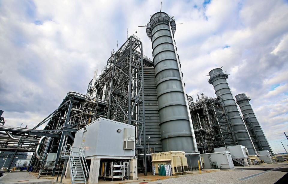 Three new 150-foot smokestacks, which emit steam, not smoke, at the new FPL Next Generation Clean Energy Center in Riviera Beach replace the 300-foot smokestacks toppled when the old power plant was torn down. (Lannis Waters / The Palm Beach Post)