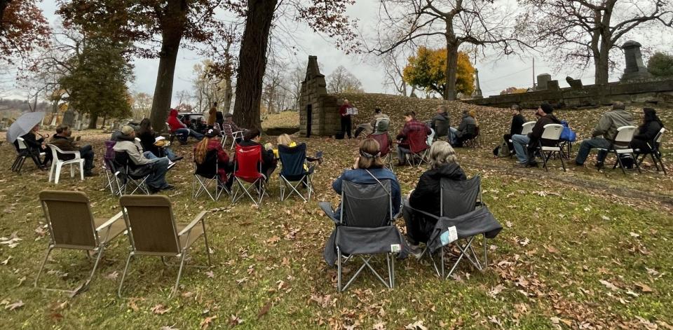 Attendees listen to stories of Coshocton's horrifying history through a program by the Coshocton County District Library in 2022. A new edition will be 5:45 p.m. Halloween night at Oak Ridge Cemetery.