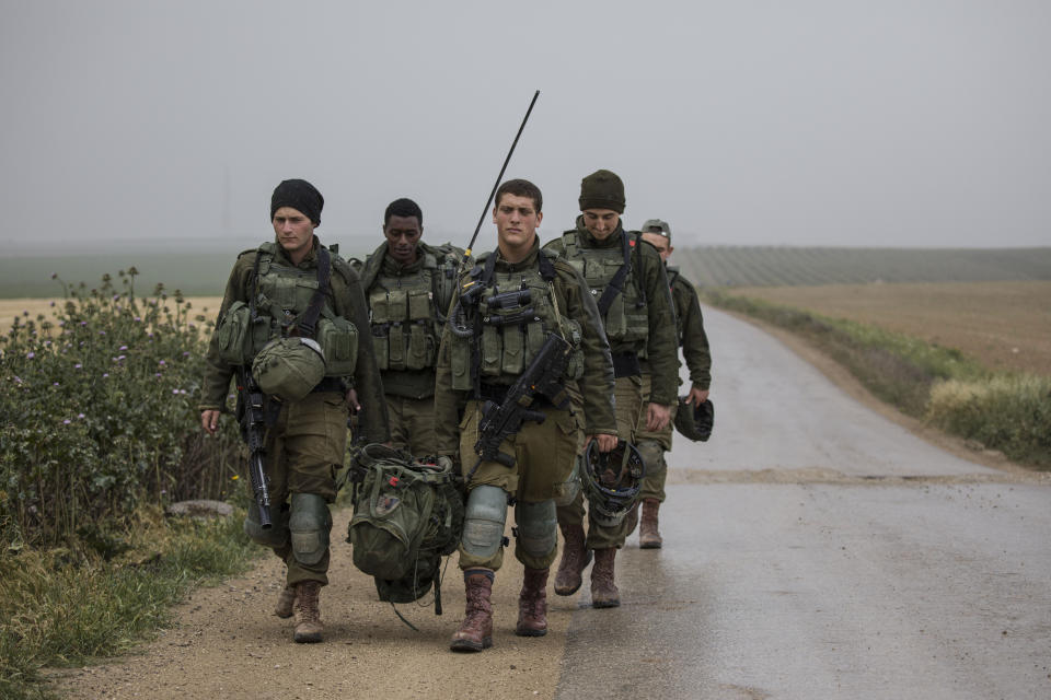 Israeli soldiers deploy on the Israel and Gaza border during a Palestinian protest, Saturday, March 30, 2019. (AP Photo/Tsafrir Abayov)