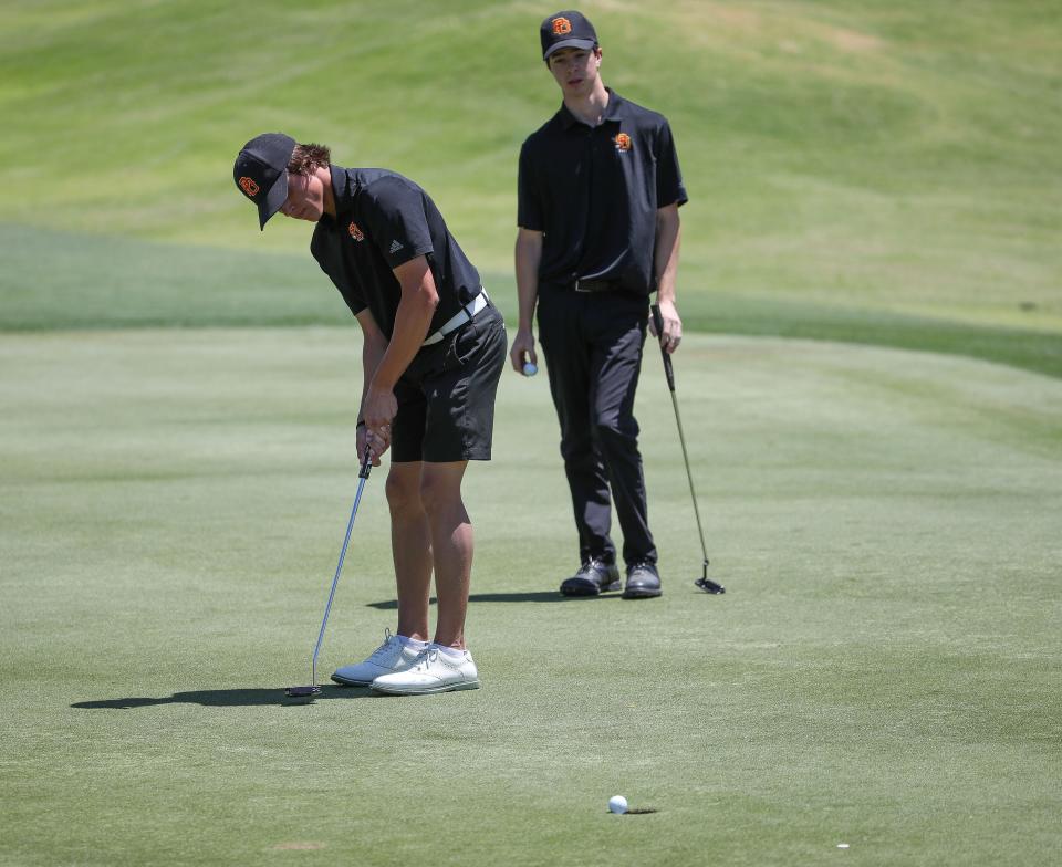 Caden Breisch sinks a par putt on the first hole for Palm Desert High School during the Desert Empire League golf championships at the Mission Hills North Gary Player Signature Course in Rancho Mirage, Calif.,  May 3, 2023.