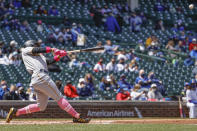 Pittsburgh Pirates' Wilmer Difo hits a two-run single off Chicago Cubs starting pitcher Kyle Hendricks during the first inning of a baseball game, Sunday, May 9, 2021, in Chicago. (AP Photo/Kamil Krzaczynski)